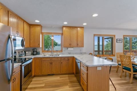 Kitchen with lake views and extra counter top dining space.