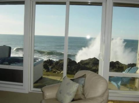 Floor-to-ceiling windows bringing the coastline right inside