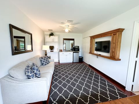 Spacious front living room with sitting area and TV