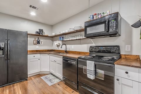 The second floor kitchen is fully stocked