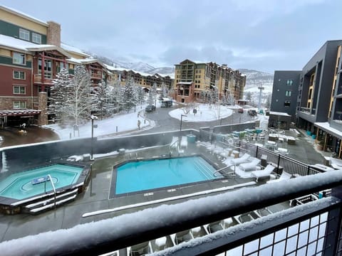 The condo has mountain and pool views. The pool and hot tub are open year-round. This is the view just below your window. 