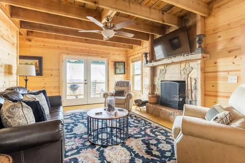 Your den is open concept with new furniture 55 inch Roku TV that streams Spectrum cable and a wood b