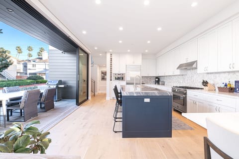 The kitchen is outfitted with premium stainless steel appliances and all the necessary cook and bakeware
                