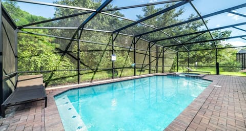 Relax in this private screened pool oasis, surrounded by nature and tranquility.