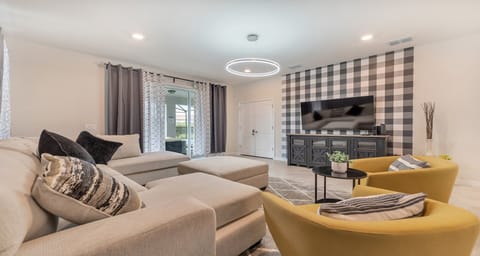 Sophisticated living room, plush furnishings, creating comfort.