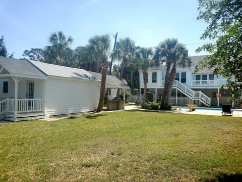 Marshview Cottage is in backyard of main house.
