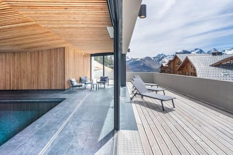 Lounge in the sun by the indoor pool.