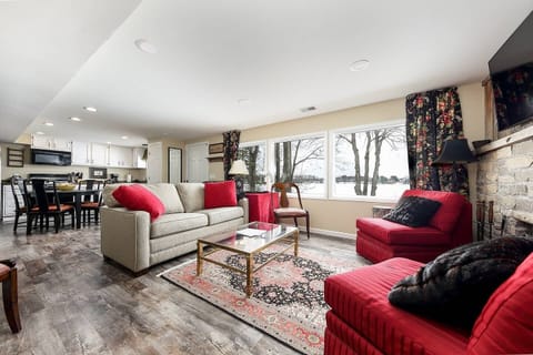 Lower level family room with picture windows overlooking lake. Pull out sofa bed