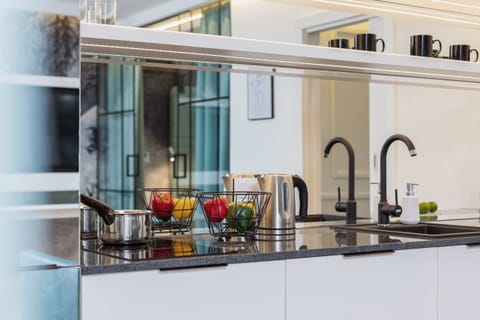 Close-up of the marble kitchen worktop. The whole looks elegant and stylish.