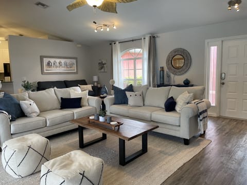 open concept living room over looking pool and canal!