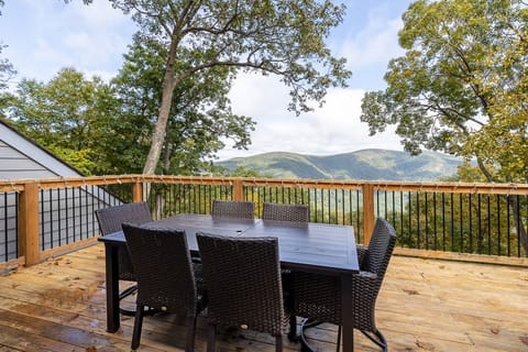 Enjoy a meal at the outdoor eating area with this mountain view as your backdrop