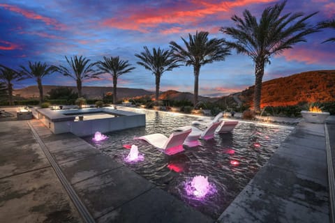 Sunset vibes and glowing fountains make this pool the ultimate retreat!