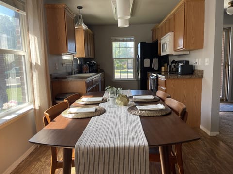 Dining area looking to kitchen