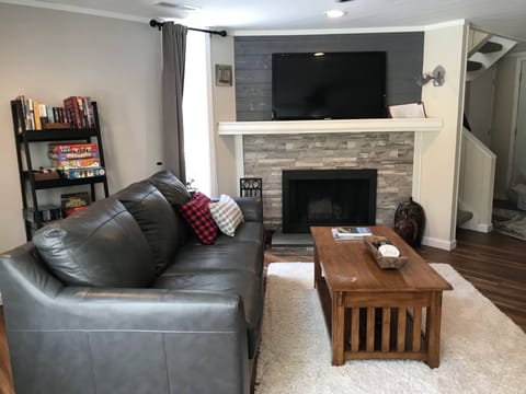 Enter the condo to the well- lit living room
