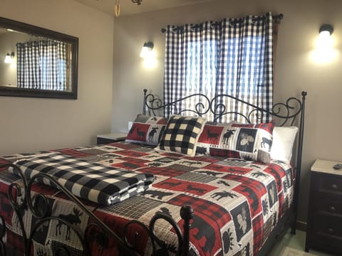 Bedroom with Smart TV & air conditioning unit