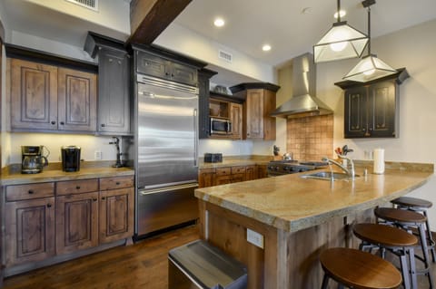 Large kitchen, fully stocked with high-end appliances.