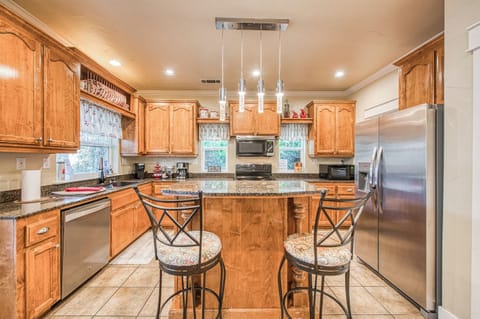 view of kitchen and 2 barstools at island