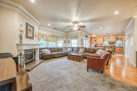 View of Living room through to kitchen. Fireplace with only duraflame logs