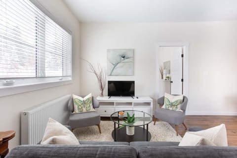 Clean, simple, and modern living room space to enjoy the Roku tv and relax