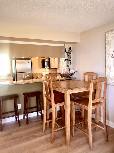 Dinning table is high enough to enjoy the view. Breakfast nook with high chairs.