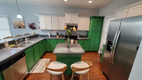 Fully stocked kitchen! Peek next to the fridge to find the coffee nook.