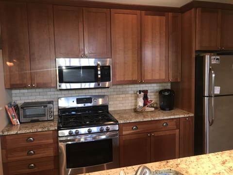 Kitchen with gas stove and Keurig coffee maker