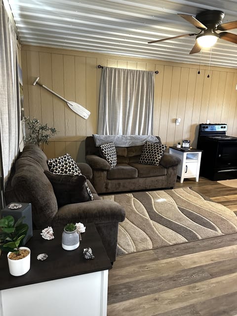 Relax on the couch while watching the flat screen smart Tv