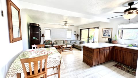 Dinning table with 3 chairs and two bar chairs to seat comfortably 5 people