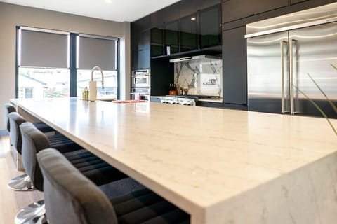 This gorgeous island complete with granite countertops gives the Chef ample preparation space