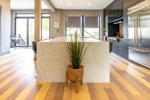 Don't let the chef cook alone. Sit at the kitchen island and help them out.