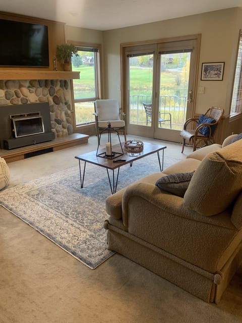 Family room off of kitchen...tv over fireplace. Walk out balconies.