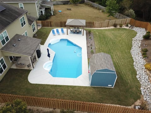 Backyard oasis, heated/cooled saltwater pool, lighted gazebo, gas grill