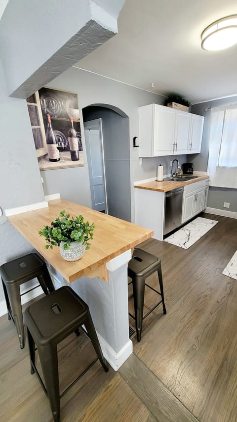 Bar top seats 4, upstairs dining set seats 4, downstairs set seats 4.