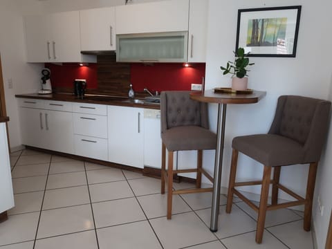 Cabinetry, Furniture, Plant, Building, Countertop, Tap, Wood, Drawer, Chair, Houseplant