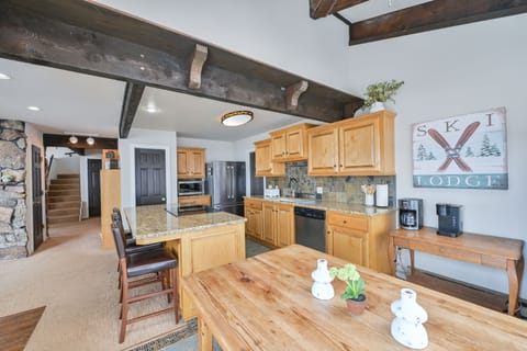 Eat in kitchen with dining table that seats 6 + 3 bar stools