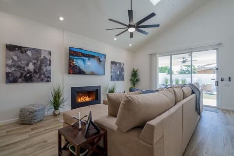 Family Room: 75" Smart TV +Natural Gas Fireplace