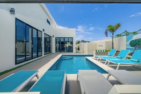 Soak up the sun in style by the pool, complete with comfy lounge chairs for the ultimate in relaxation and laid-back vibes.