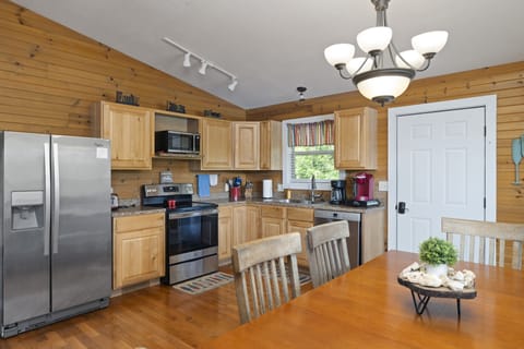 Fully equipped kitchen with stainless steel appliances.