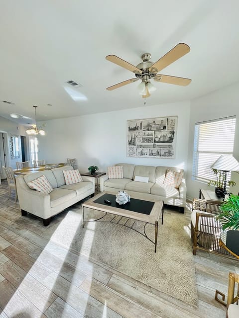 Relax in your bright, airy living room with plush seating and modern coastal touches that make you feel instantly at home.