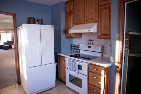 Kitchen includes a double oven, popcorn bar, dishwasher, custom spices & more!