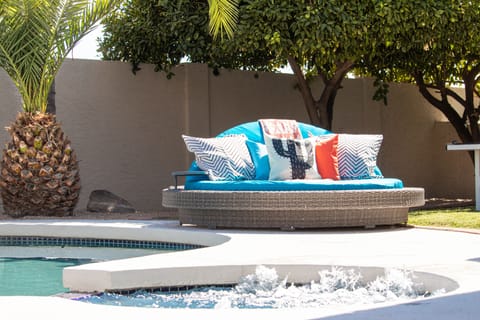 Lounge in the comfortable daybed and pick fresh lemons oranges from the trees.