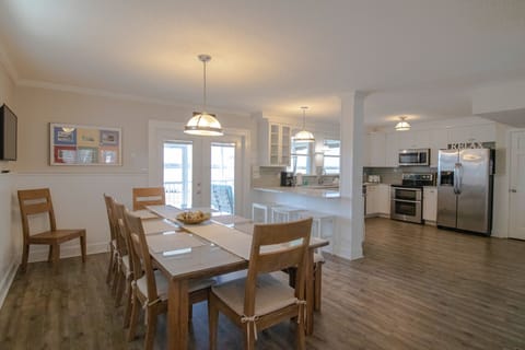 Large dining table and kitchen