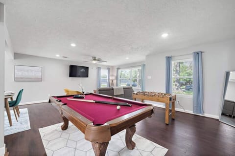 Full-size pool table and foosball table included.