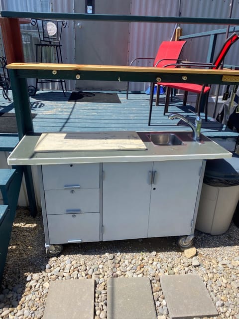 Counter with running water for fish cleaning and processing game.