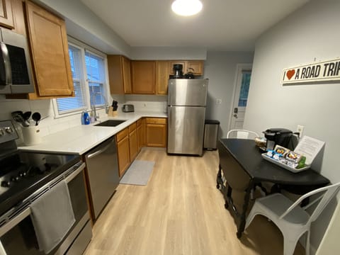 Kitchen with fridge and table and chairs 