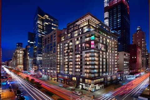 Arrive to a sleek, illuminated building in the heart of downtown.