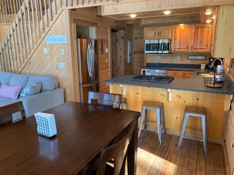 Seating includes an extendable table that seats six, plus a breakfast bar.