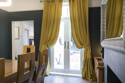 Patio door in the dining room leading to enclosed garden