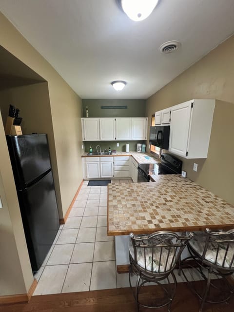 Kitchen with peninsula seating for two