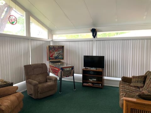 Sun Room w/ Pinball Machine. This room has an external gas heater.
